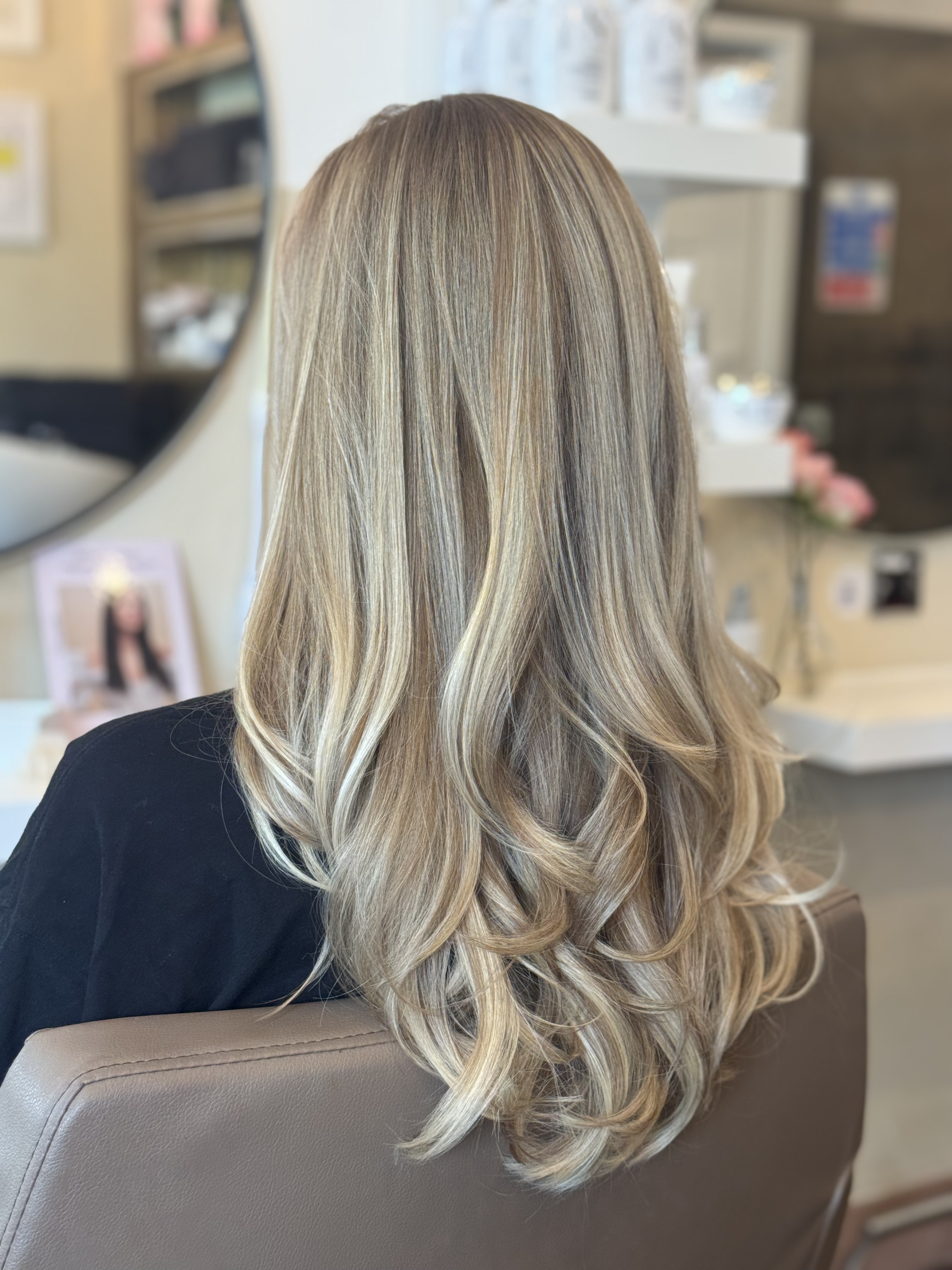 Long Blonde Layers with Soft Curls